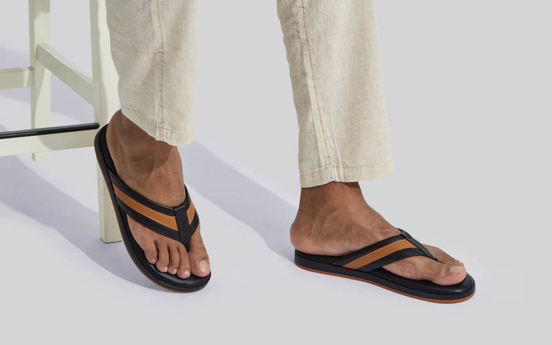 Black and tan flip flops store